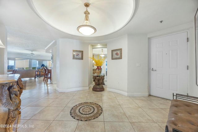 tiled foyer entrance featuring ceiling fan