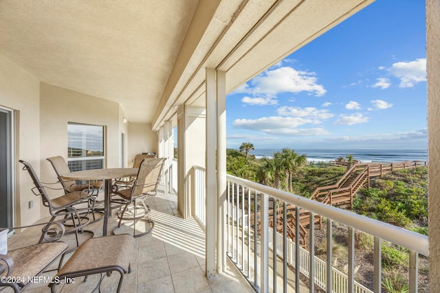 balcony featuring a water view