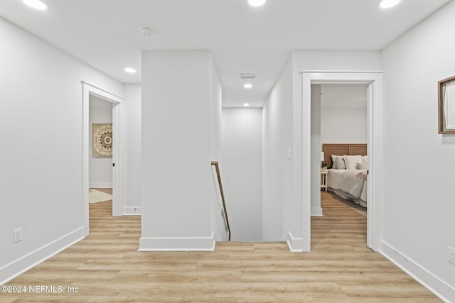 corridor featuring light wood-type flooring