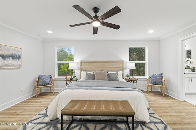 bedroom featuring crown molding, ensuite bathroom, ceiling fan, and light hardwood / wood-style flooring