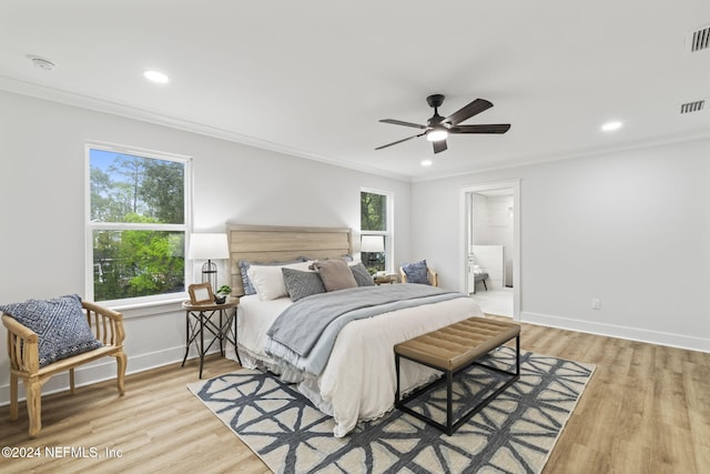 bedroom featuring light hardwood / wood-style flooring, ornamental molding, and ceiling fan