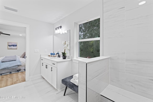 bathroom with vanity and ceiling fan