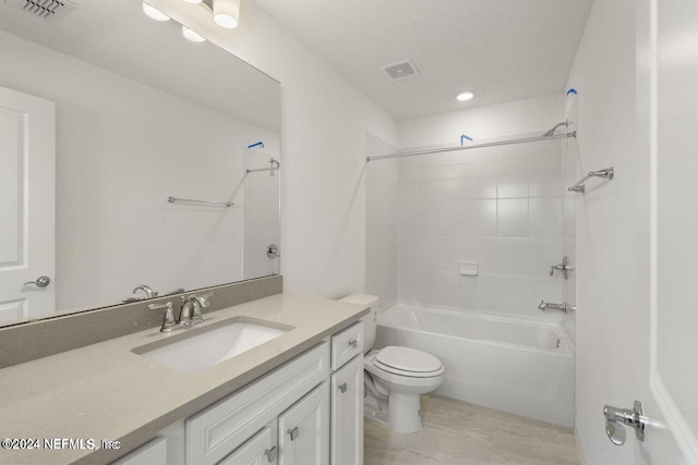 full bathroom featuring vanity, toilet, and tiled shower / bath combo