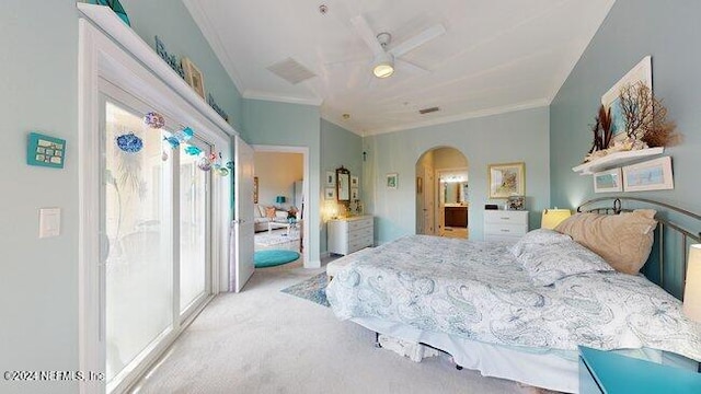 bedroom featuring multiple windows, ceiling fan, crown molding, and light carpet