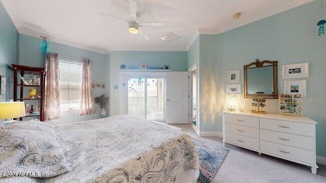 carpeted bedroom featuring ornamental molding and ceiling fan