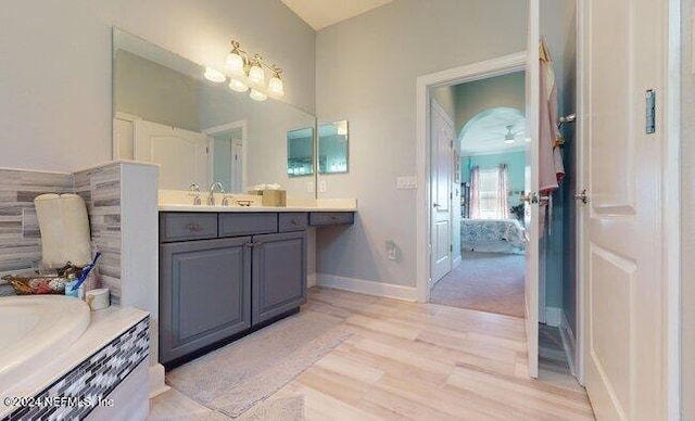 bathroom with an inviting chandelier and vanity