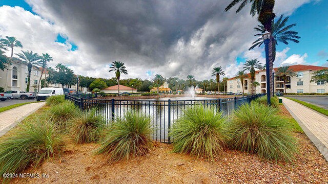 view of pool featuring a water view