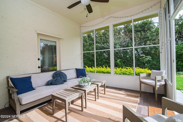 sunroom / solarium with ceiling fan and a healthy amount of sunlight