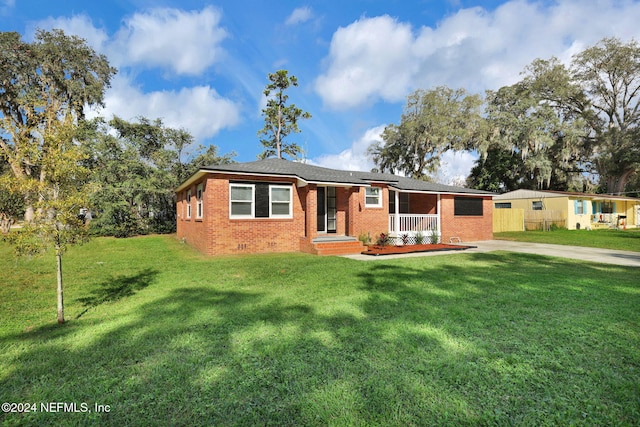 single story home featuring a porch and a front yard