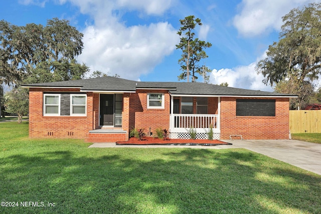 single story home with a front lawn and a porch