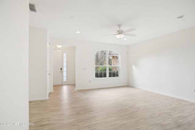 spare room featuring ceiling fan and light wood-type flooring