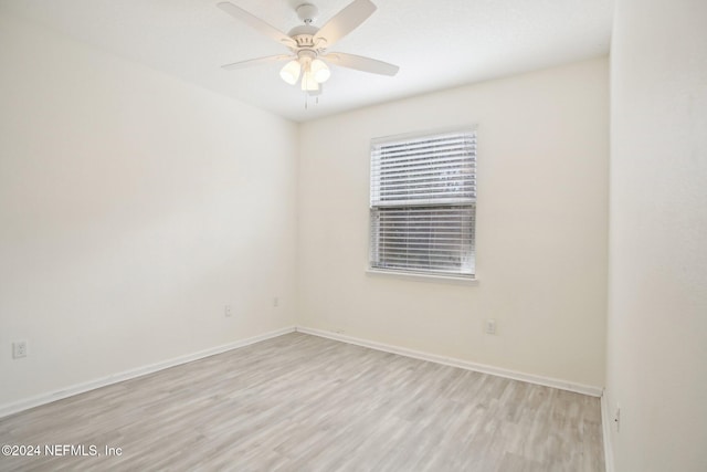 unfurnished room with ceiling fan and light hardwood / wood-style flooring