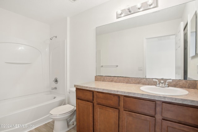 full bathroom featuring vanity, shower / bathing tub combination, wood-type flooring, and toilet