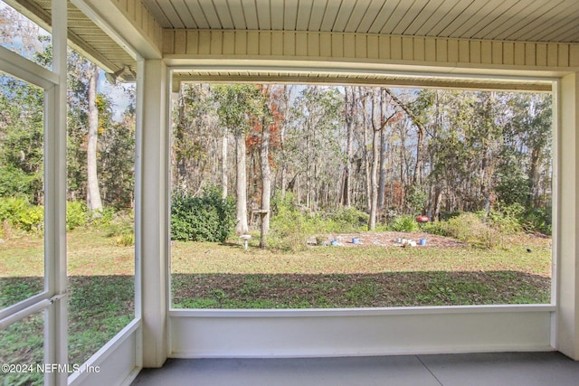 unfurnished sunroom featuring wood ceiling