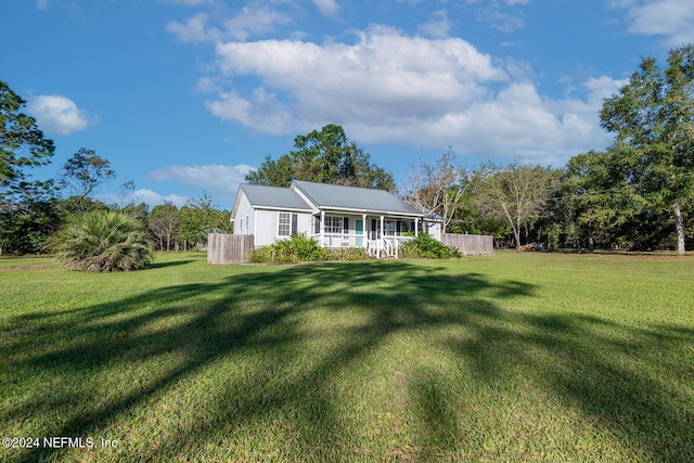 exterior space with a front lawn and covered porch