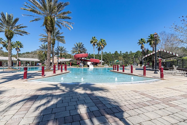 view of pool with a water slide