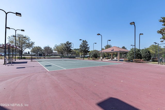 view of tennis court featuring a gazebo and basketball court