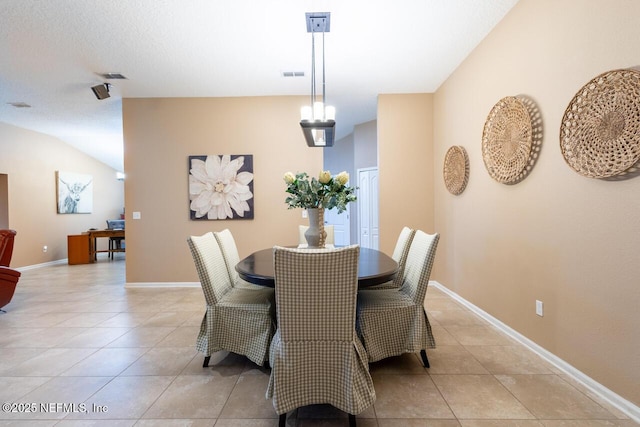 dining room featuring light tile patterned floors, baseboards, and visible vents