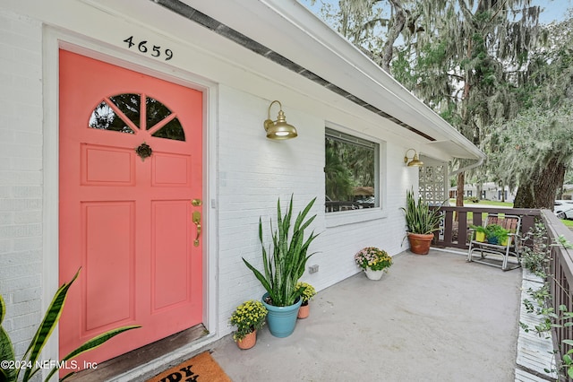 doorway to property with a porch