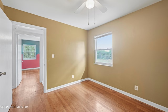 unfurnished room featuring ceiling fan and light hardwood / wood-style flooring