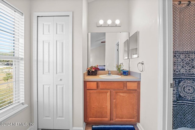 bathroom with vanity and a healthy amount of sunlight