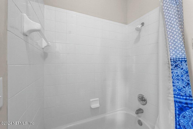 bathroom featuring shower / bath combination with curtain