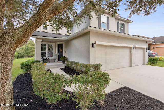 view of front of property with a garage