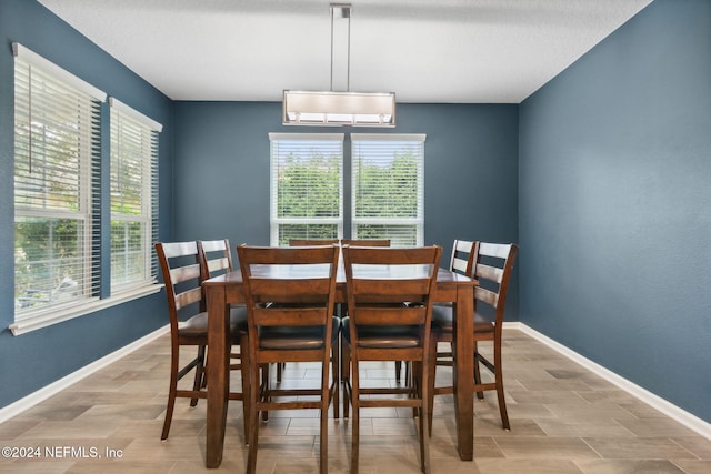 dining area with an inviting chandelier