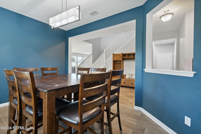 dining space featuring hardwood / wood-style flooring