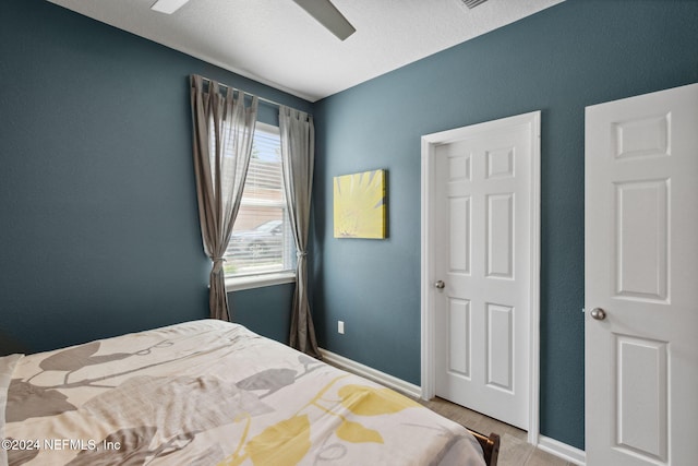 bedroom featuring a textured ceiling and ceiling fan