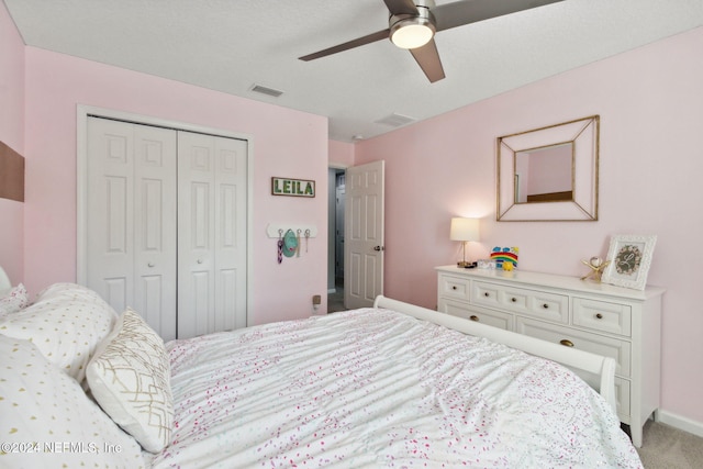 carpeted bedroom featuring ceiling fan and a closet