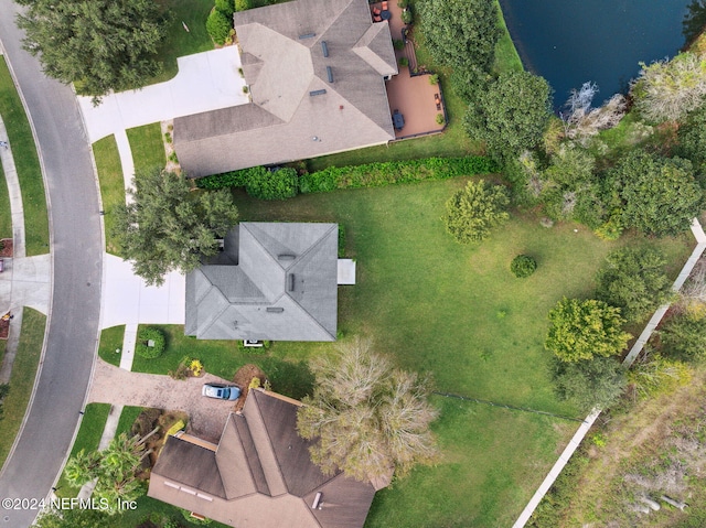 birds eye view of property with a water view