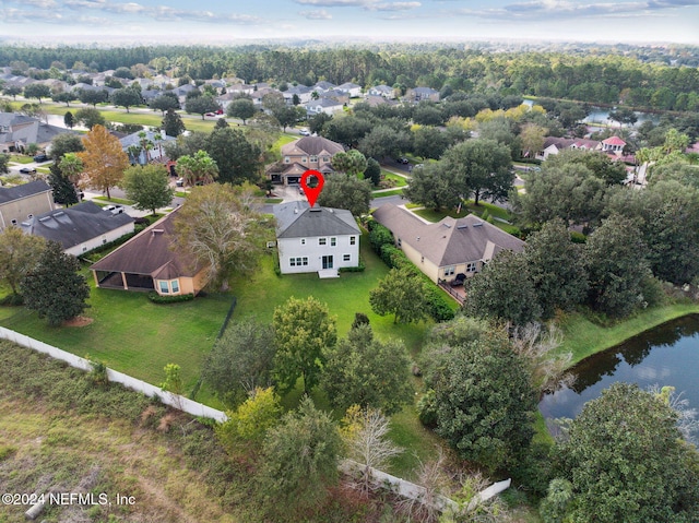 birds eye view of property featuring a water view