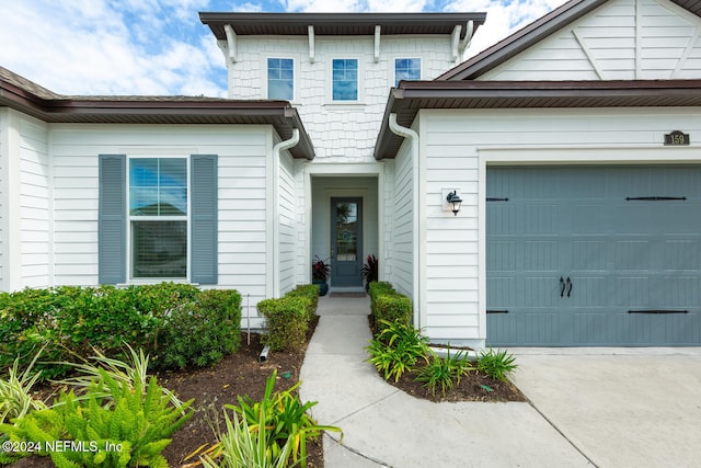 property entrance with a garage