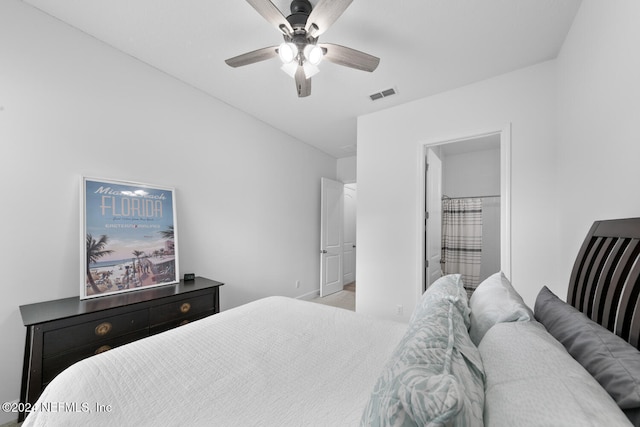 bedroom featuring connected bathroom and ceiling fan