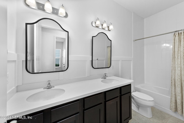 full bathroom with toilet, shower / bath combo, vanity, and tile patterned floors