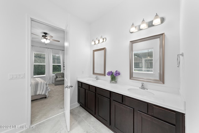 bathroom featuring tile patterned flooring, vanity, and ceiling fan