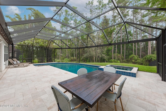 view of swimming pool with a lanai, an in ground hot tub, and a patio