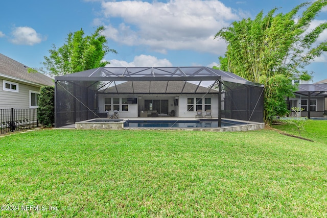 back of house featuring an outdoor hangout area, a lanai, and a lawn