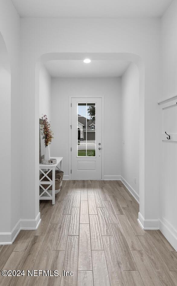 doorway featuring light wood-type flooring