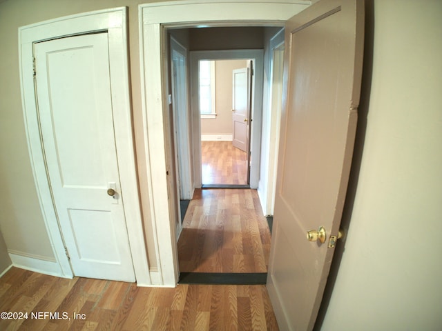 hall with light wood-type flooring