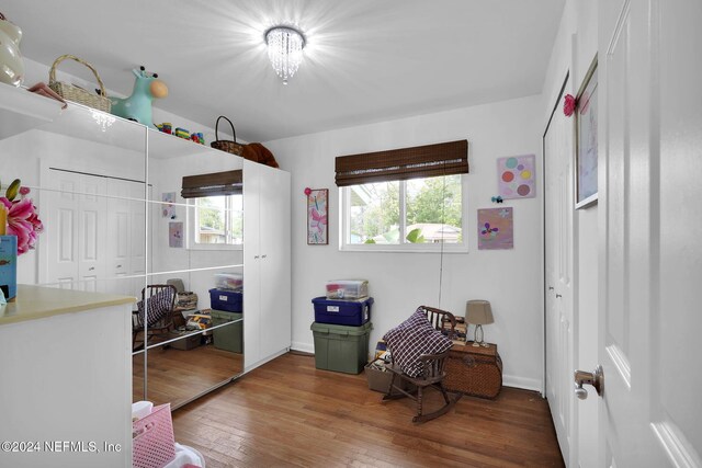 sitting room with hardwood / wood-style floors