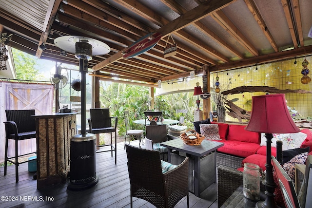 wooden terrace featuring outdoor lounge area