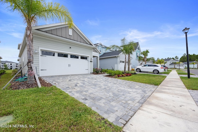 view of home's exterior with a lawn and a garage