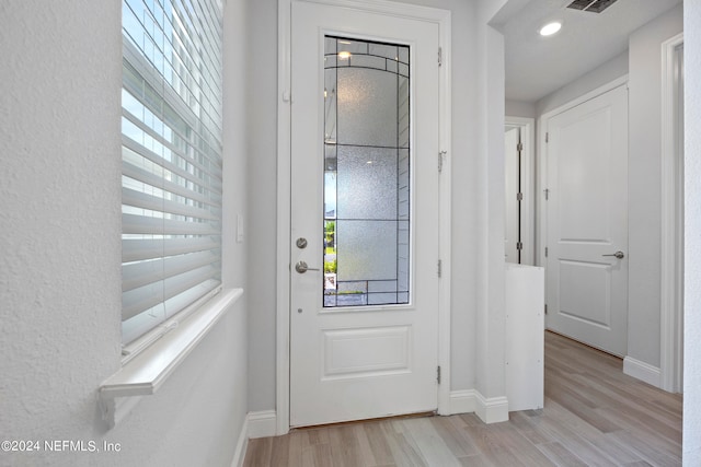 foyer with light wood-type flooring