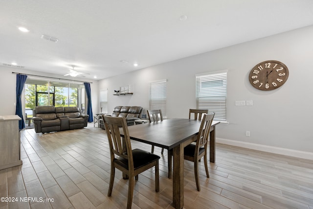 dining area featuring ceiling fan and light hardwood / wood-style flooring