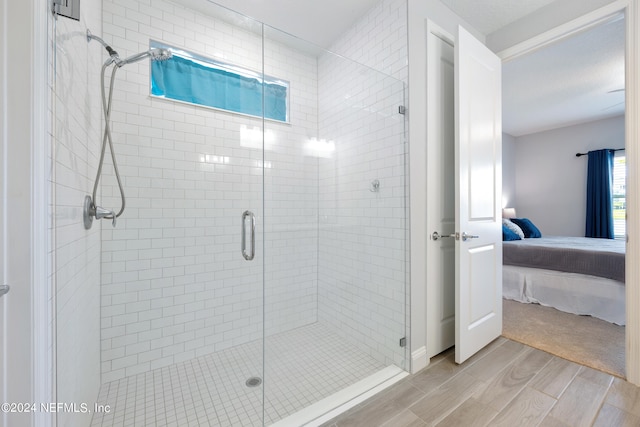 bathroom featuring an enclosed shower