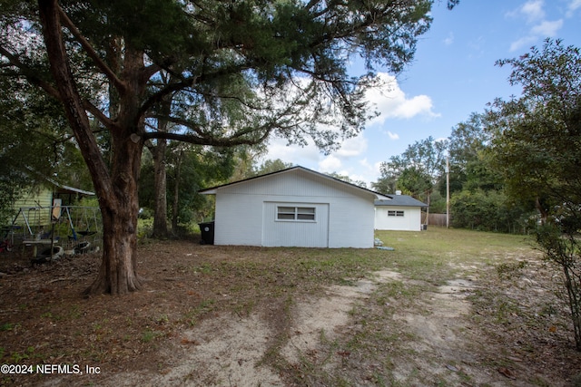 view of side of property with an outdoor structure