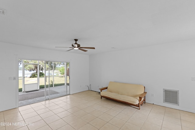 unfurnished room featuring ceiling fan and light tile patterned flooring