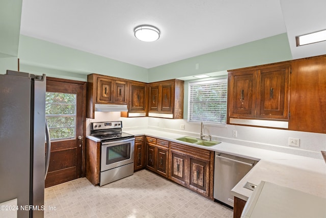 kitchen featuring sink, plenty of natural light, and appliances with stainless steel finishes